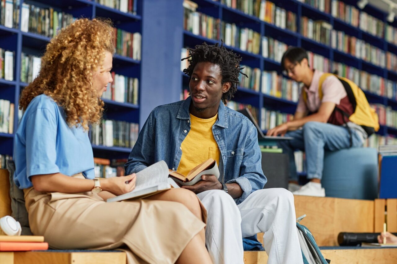 two students working in library